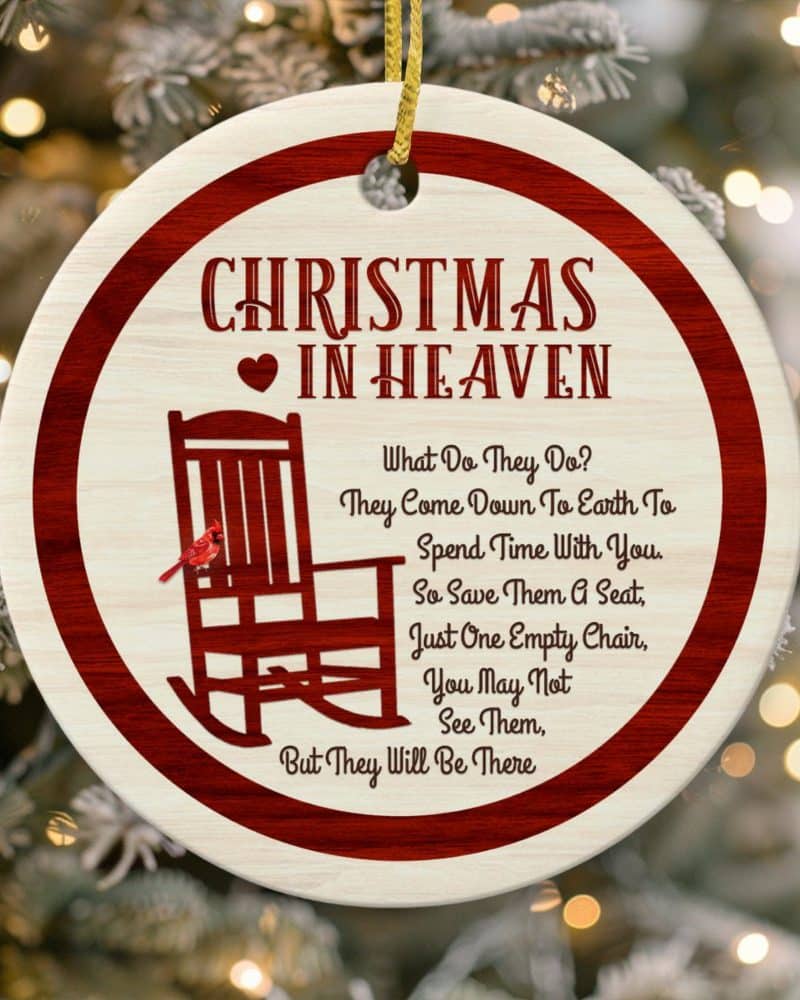 Round Christmas ornament with a red border; features a rocking chair, a cardinal, and a poem about loved ones in heaven.