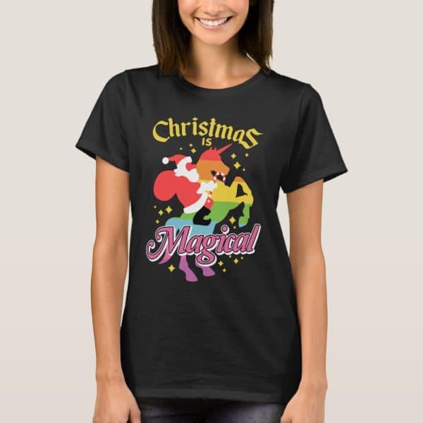 Black T-Shirt Featuring A Rainbow Unicorn With Santa Claus Riding It, Text Above Reads Christmas Is, Text Below Reads Magical.