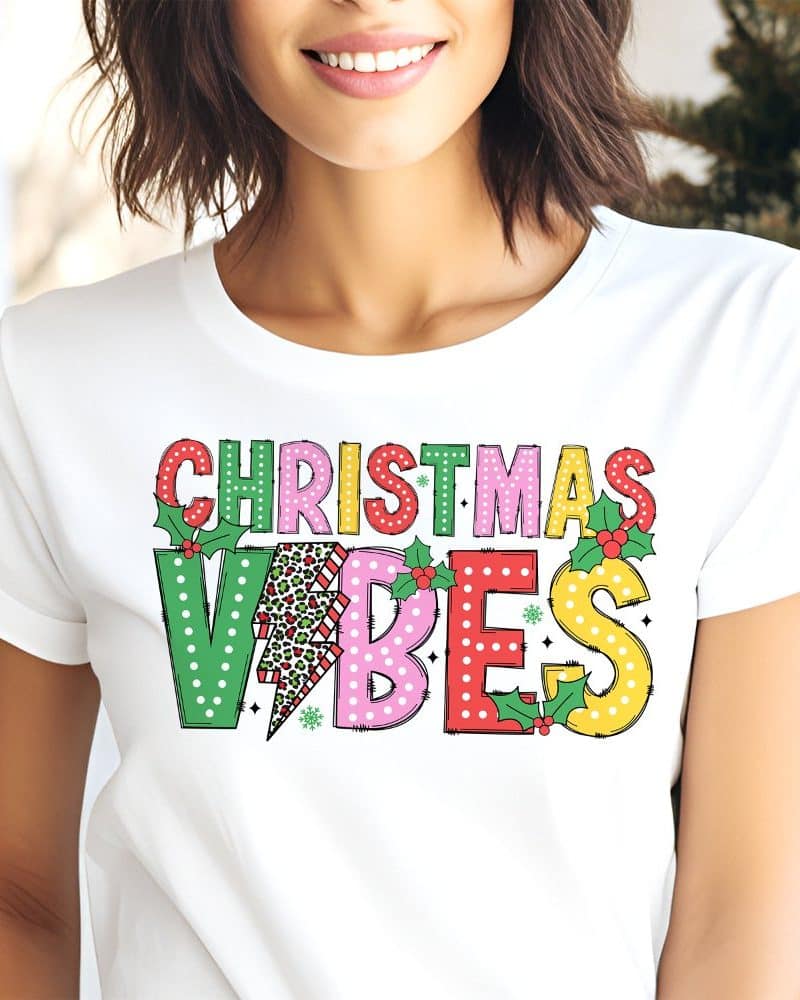 White t-shirt with colorful Christmas Vibes text.