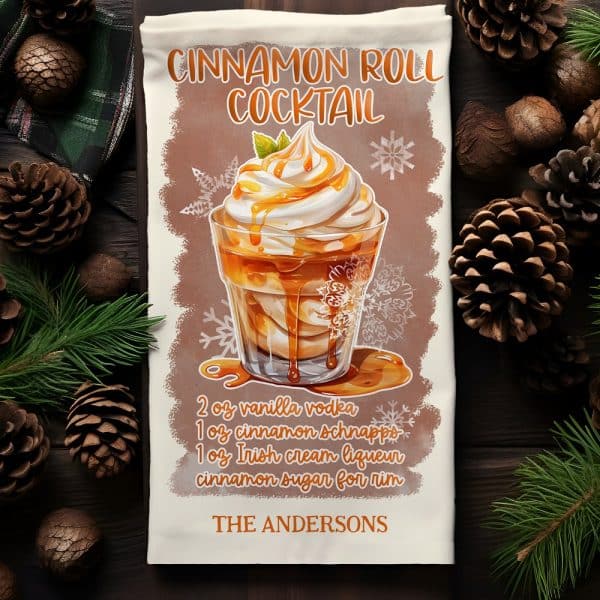 Kitchen Towel Featuring A Cinnamon Roll Cocktail Recipe With Illustration Of The Drink In A Rocks Glass Topped With Whipped Cream And Caramel Drizzle.