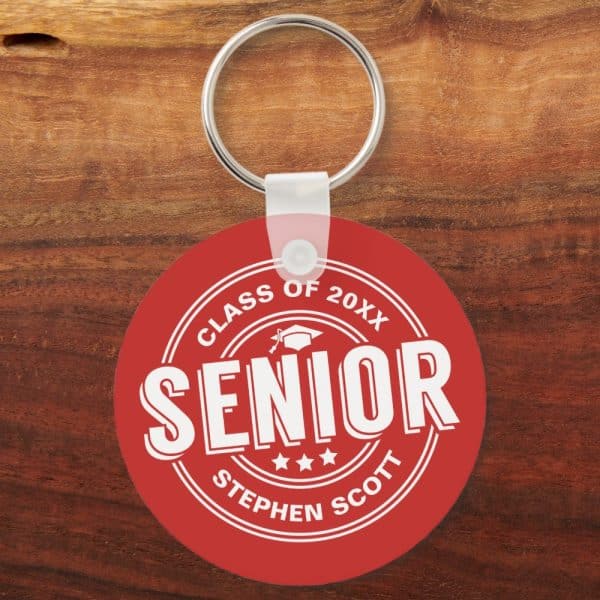 Red Round Keychain With White Text. The Text Says Senior, Class Of 20Xx, And Stephen Scott. A Graduation Cap Icon Is Also Present.