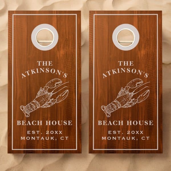 Pair Of Wooden Cornhole Boards, Each Featuring A Lobster Illustration And The Atkinsons Beach House Text.