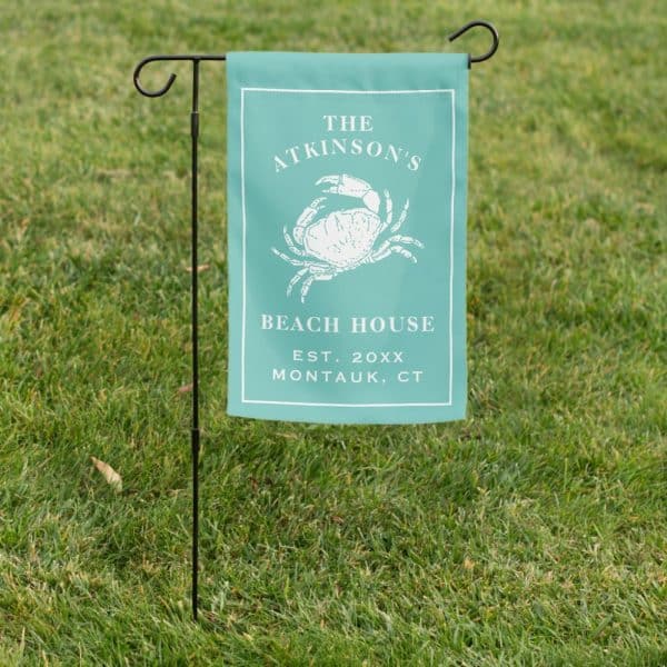 Teal Beach House Yard Sign With A Crab Illustration, The Atkinsons Family Name, And Montauk, Ct Location.