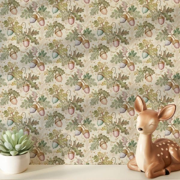 A Fawn Figurine Rests In Front Of Wallpaper Featuring A Repeating Pattern Of Acorns And Oak Leaves In Muted Greens, Pinks, And Golds On A Cream Background.