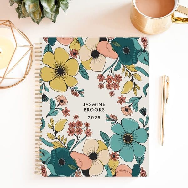 2025 Spiral-Bound Planner With A Floral Design Featuring Teal, Yellow, And Peach Flowers. The Planner Is Personalized With The Name Jasmine Brooks.