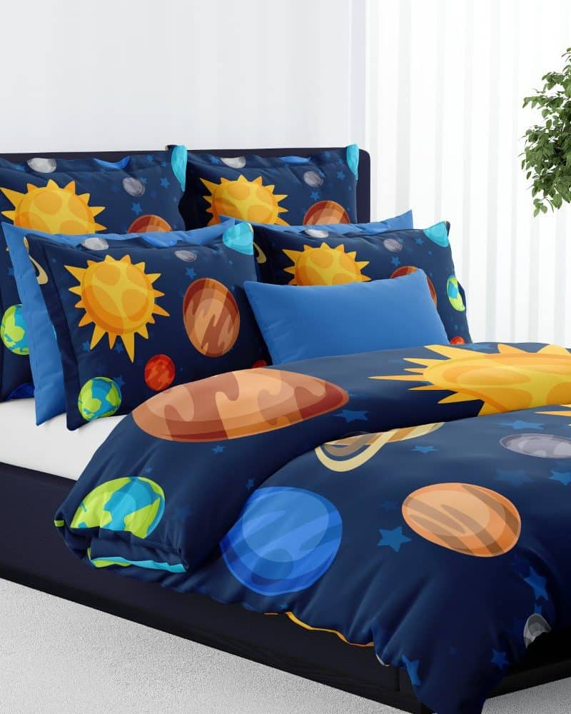 A dark blue duvet cover and pillowcases featuring a colorful solar system design.