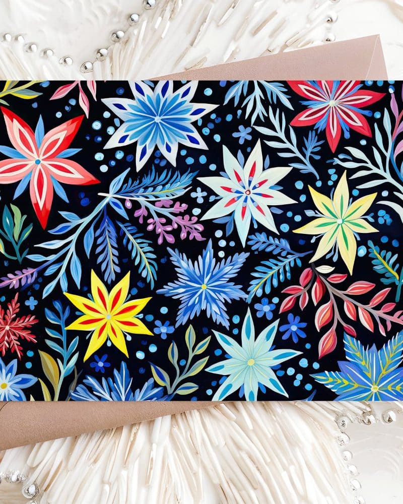 A card featuring a vibrant floral pattern in blues, reds, and yellows on a dark background.