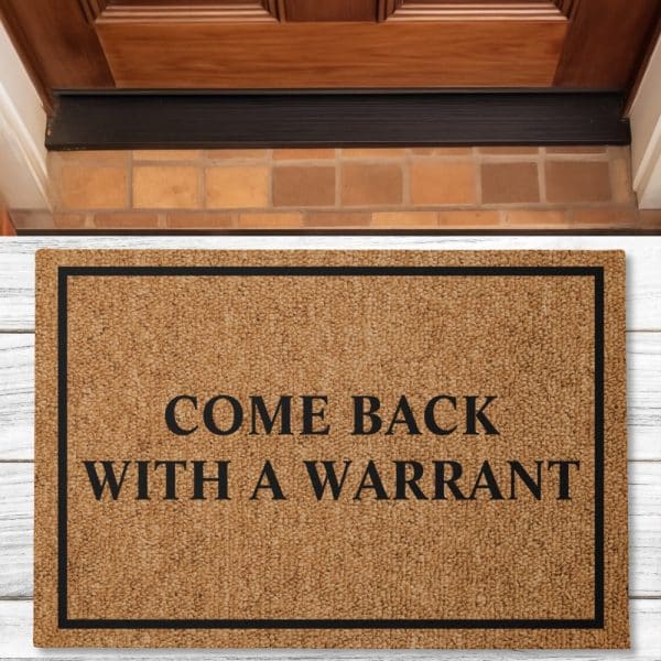 Brown Doormat With Black Border And Text: Come Back With A Warrant.