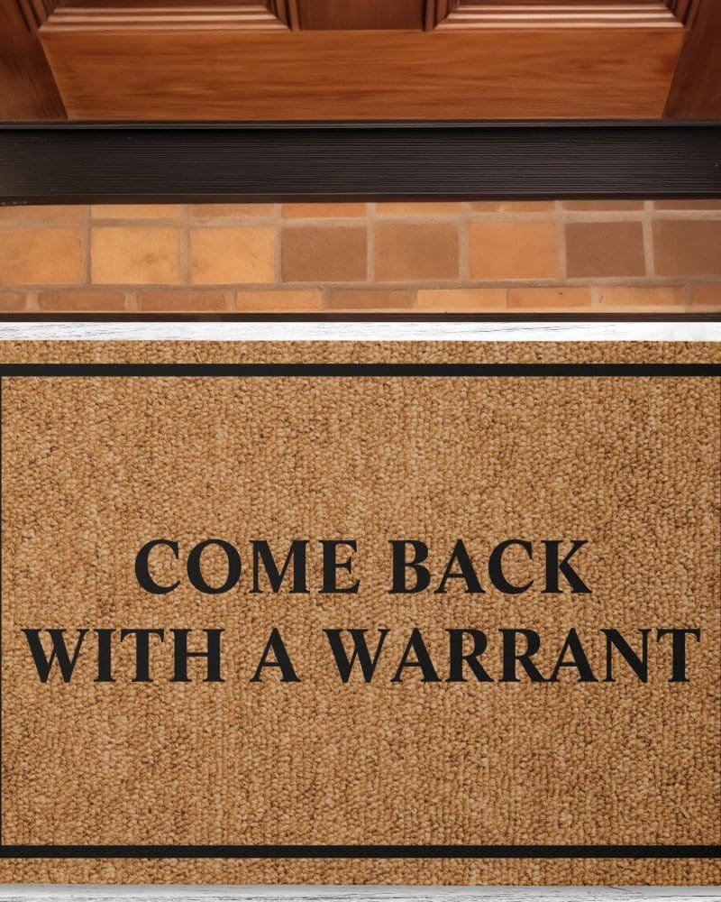 Brown doormat with black border and text: Come back with a warrant.