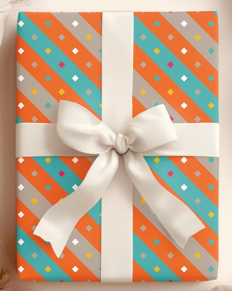 A gift box with orange, teal, and gray diagonal stripes and a white ribbon.