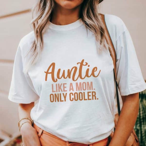 Woman Wearing A White T-Shirt That Says Auntie Like A Mom. Only Cooler.