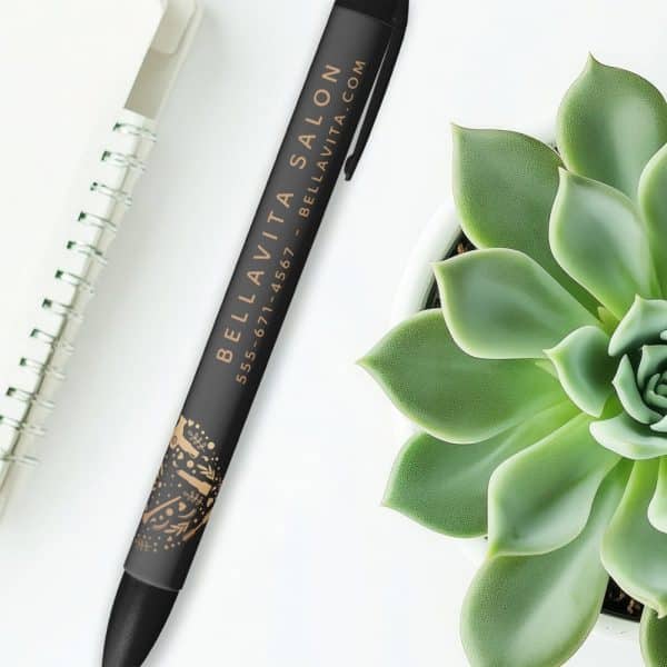 Black Pen With Bella Vita Salon Branding, Phone Number, And Website Address.