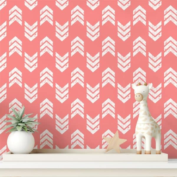 Coral Wall With A White Chevron Pattern, Featuring A Small Giraffe Toy And A Succulent Plant On A Shelf.