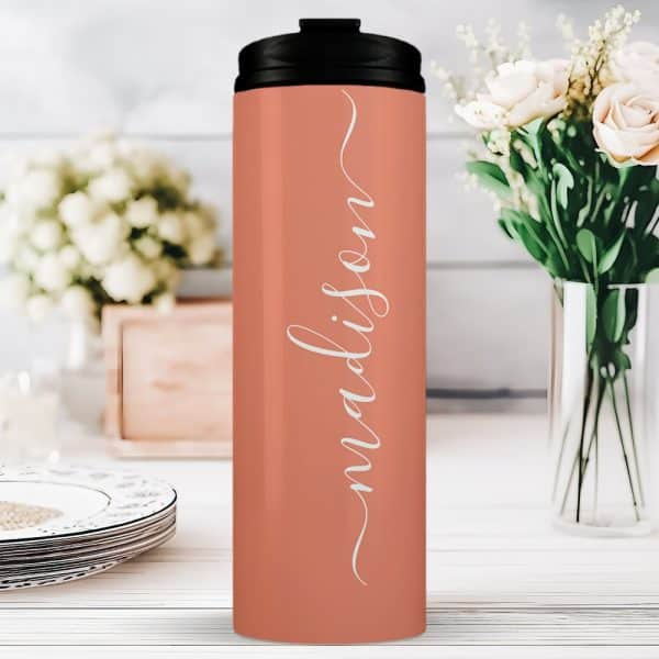 Coral-Colored Travel Tumbler With The Name Madison In White Script.