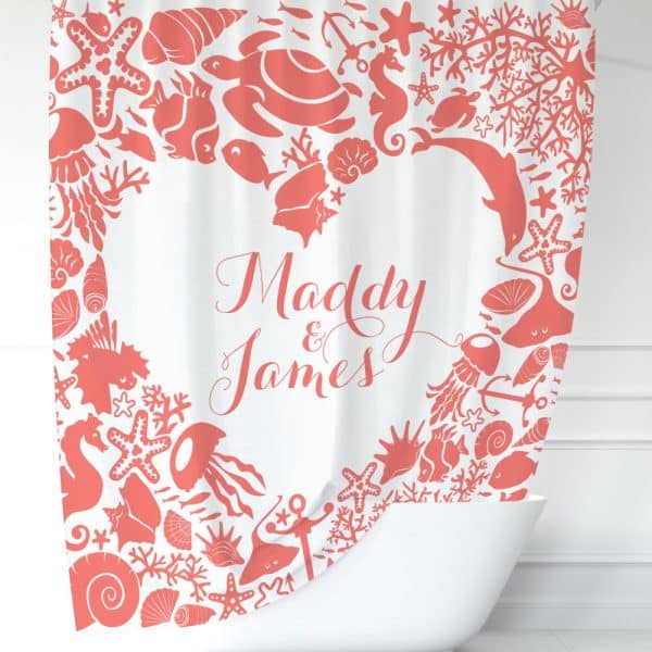 Coral-Colored Sea Life Designs Form A Heart Shape Around The Names Maddy And James On A White Shower Curtain.