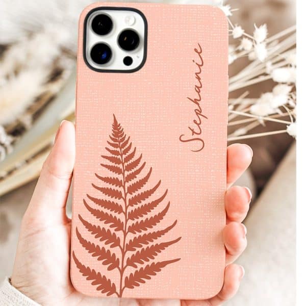 A Peach-Colored Phone Case With A Brown Fern Design And The Name Stephanie.