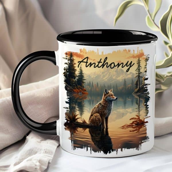 A Black And White Mug With The Name Anthony And A Fox Sitting By A Lake In A Mountain Landscape.