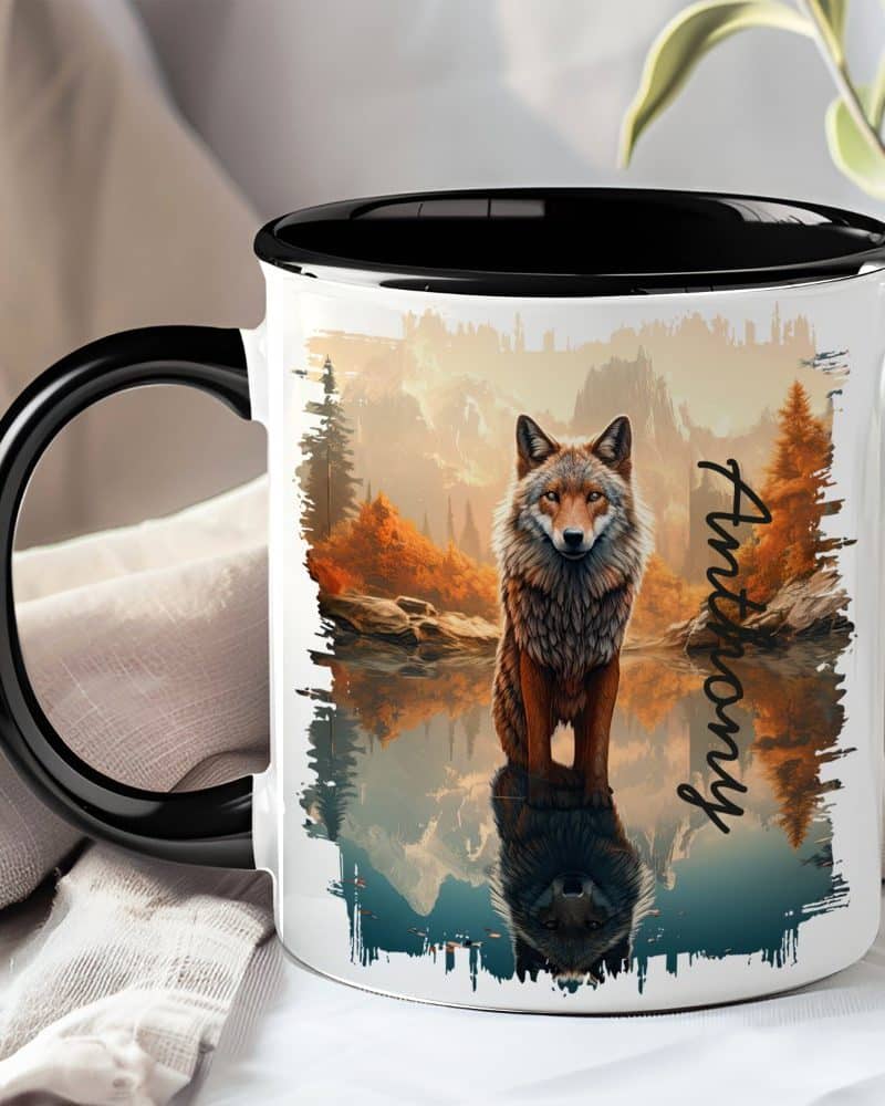 Black-handled mug with a wolf reflected in water, set against an autumnal landscape. The name Anthony is on the mug.