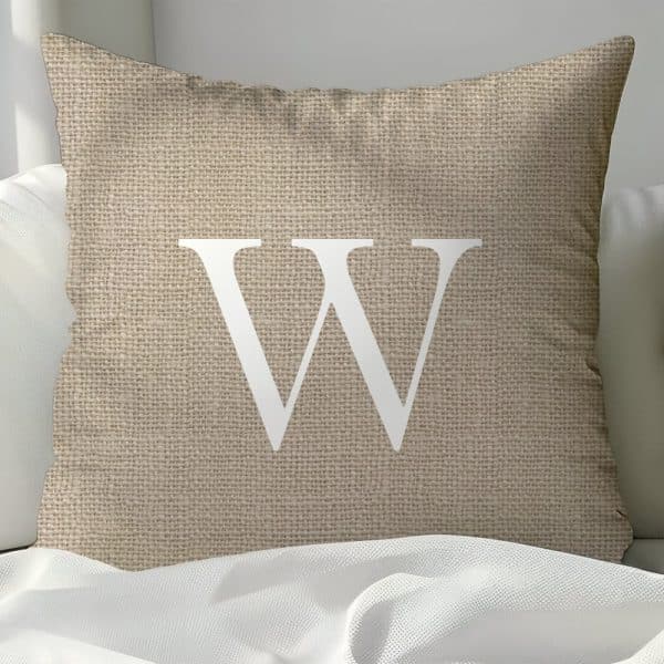 Beige Burlap Pillow With A White Capital W.