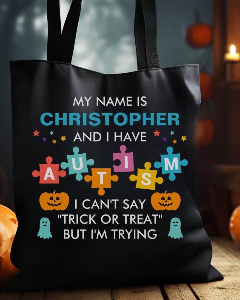Black tote bag with the name Christopher, a puzzle piece autism graphic, and Halloween-themed text.