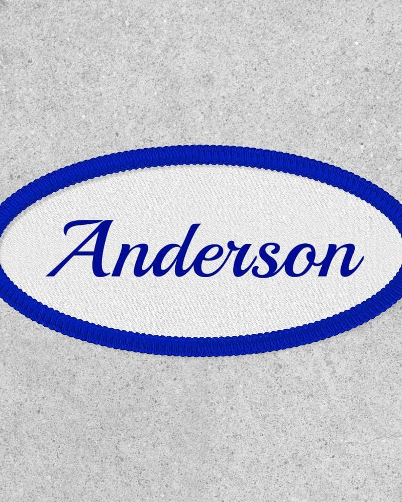 Oval name tag with blue border, the name Anderson in blue cursive lettering.