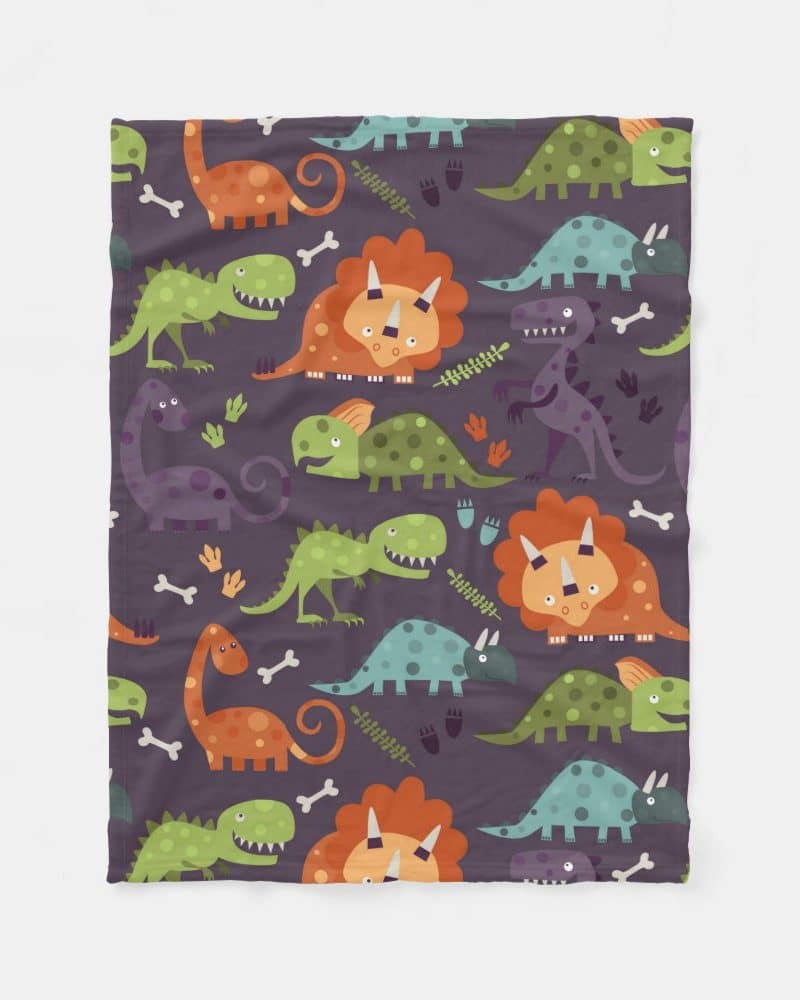 A purple baby blanket with a repeating pattern of colorful cartoon dinosaurs.