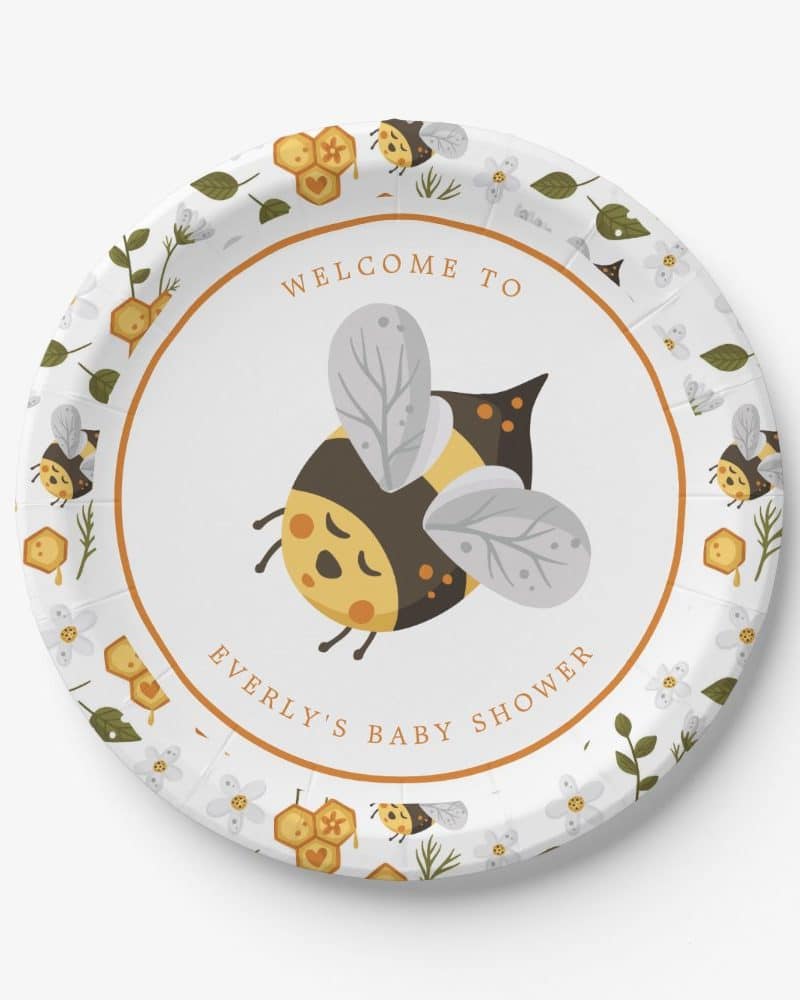 Baby shower paper plate featuring a cartoon bumblebee and honeycomb design.