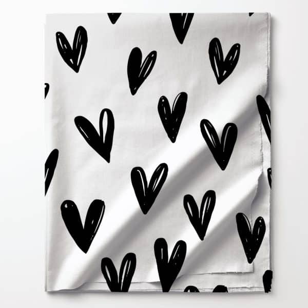 White Fabric With A Repeating Pattern Of Black Hand-Drawn Hearts.