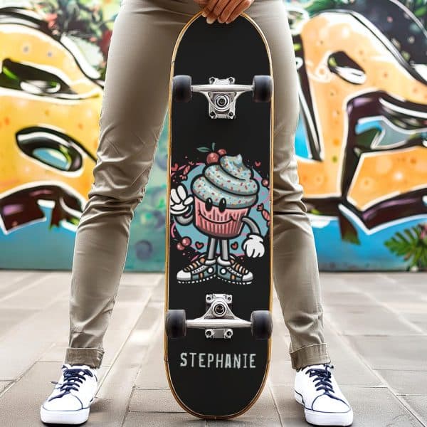 Person Holding A Skateboard With A Cartoon Cupcake Design And The Name Stephanie.