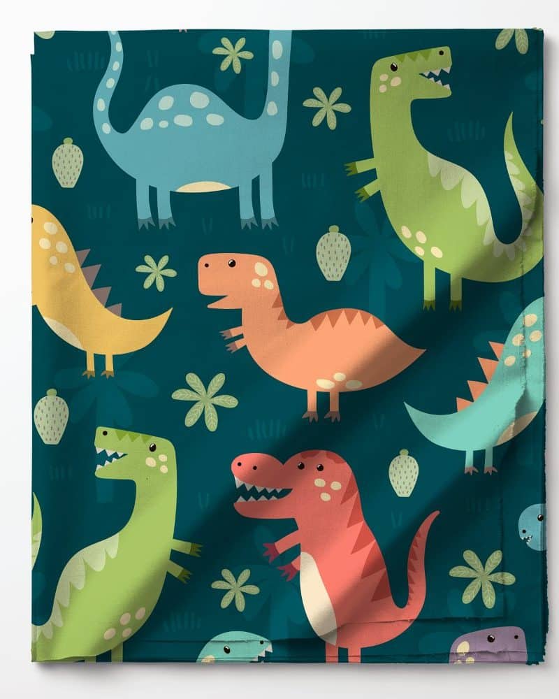 Colorful cartoon dinosaurs on teal fabric.