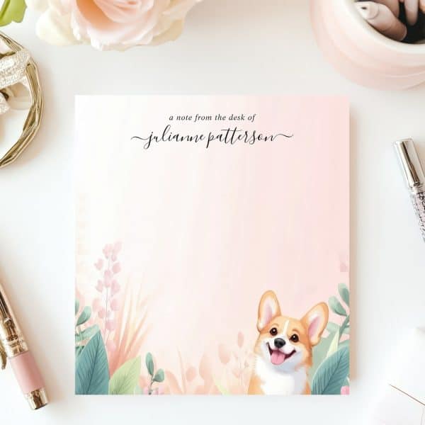 Personalized Notepad Featuring A Smiling Corgi Peeking From Behind Floral Designs.