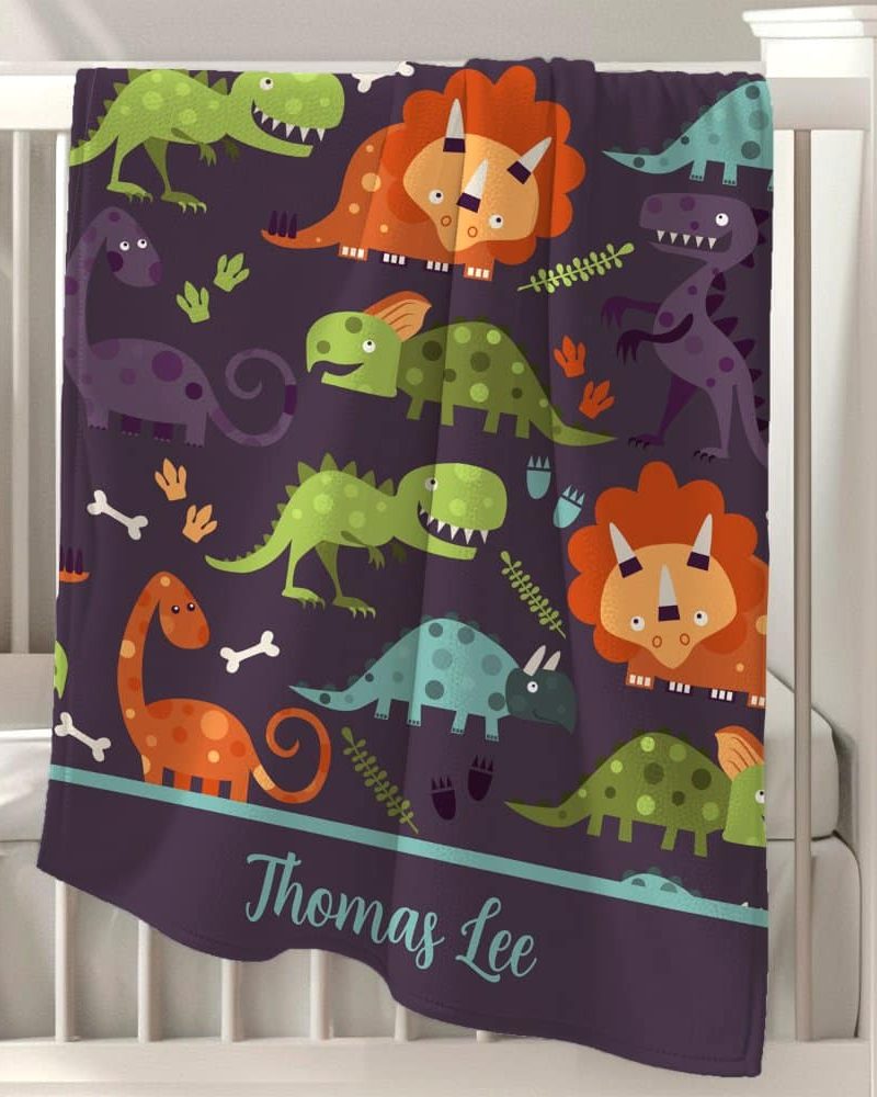Personalized dinosaur baby blanket with Thomas Lee's name.