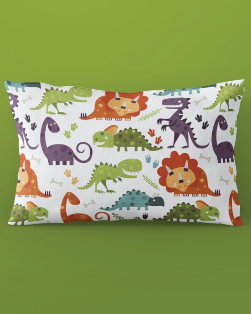 Rectangular pillow featuring a colorful repeating pattern of cartoon dinosaurs.