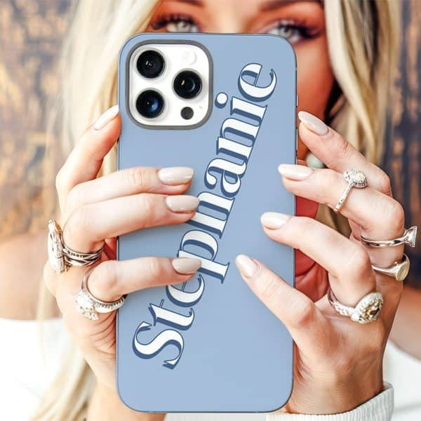 Woman'S Hands Holding A Light Blue Iphone Case With The Name Stephanie Printed On It.