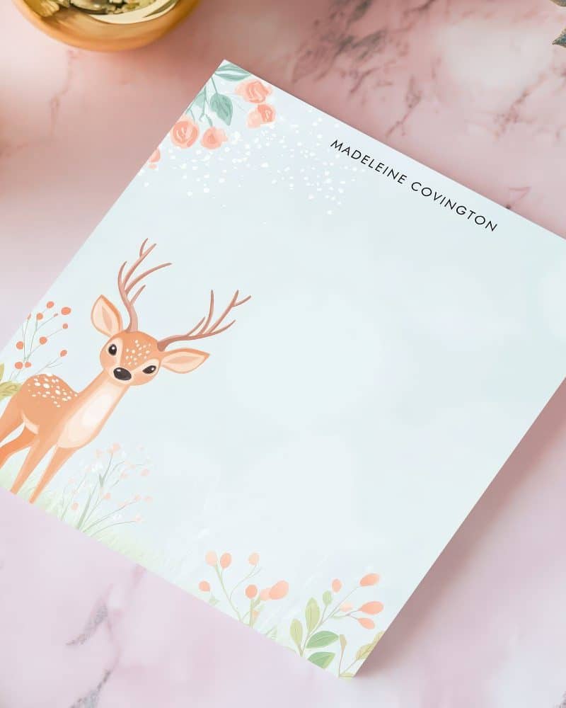 Personalized stationery featuring a fawn in a floral field.