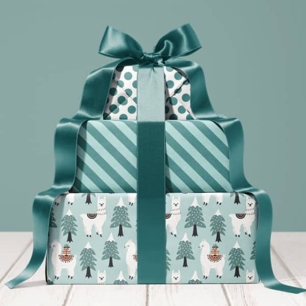 Stack Of Three Teal And White Wrapped Presents With A Large Teal Bow.