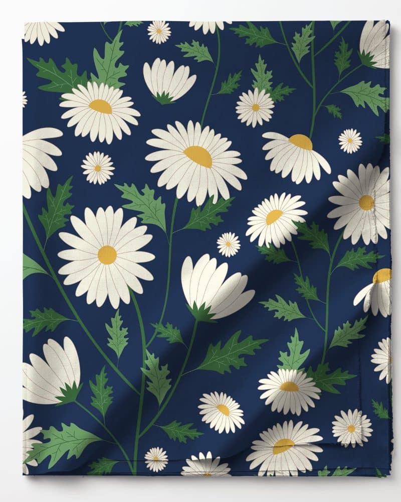 Navy blue fabric with a repeating pattern of white daisies and green leaves.