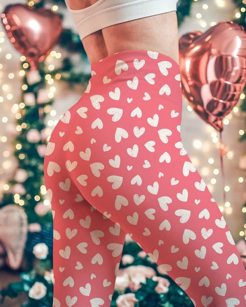 Pink leggings with a pattern of off-white hearts.