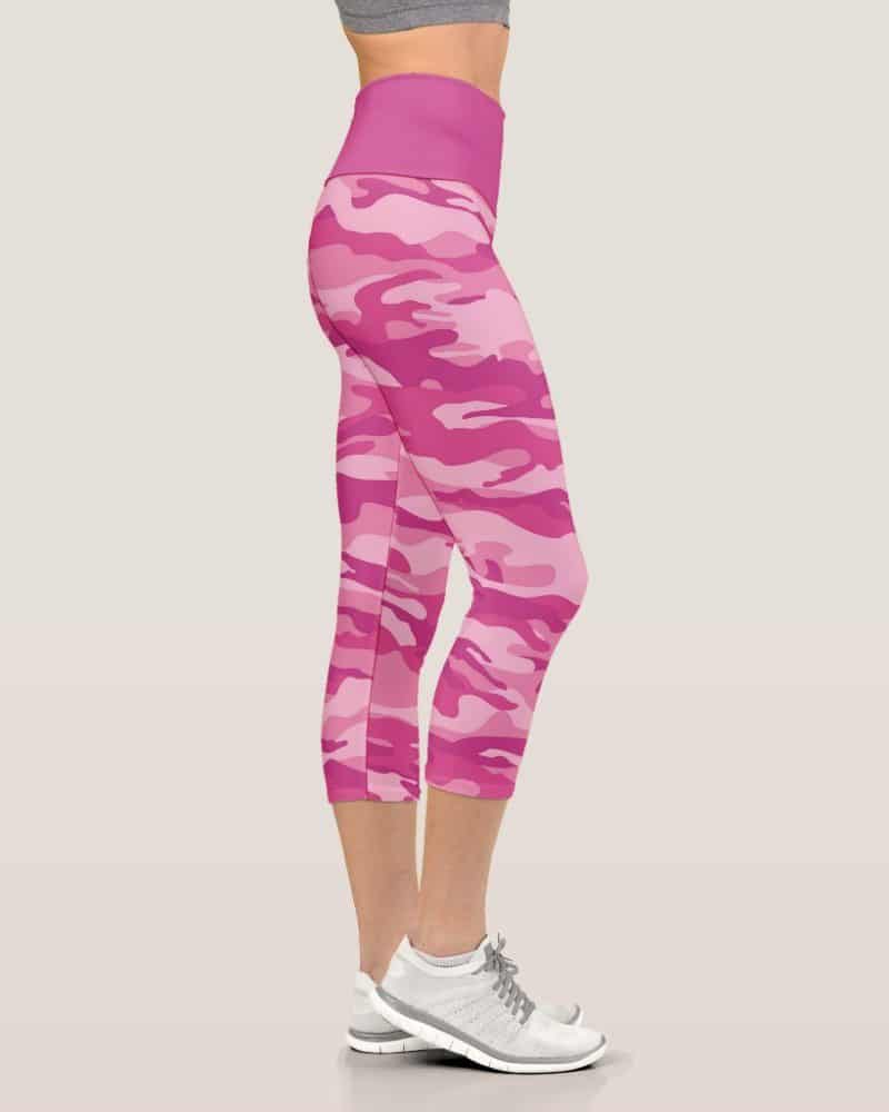 Pink camouflage cropped leggings on a woman's legs.