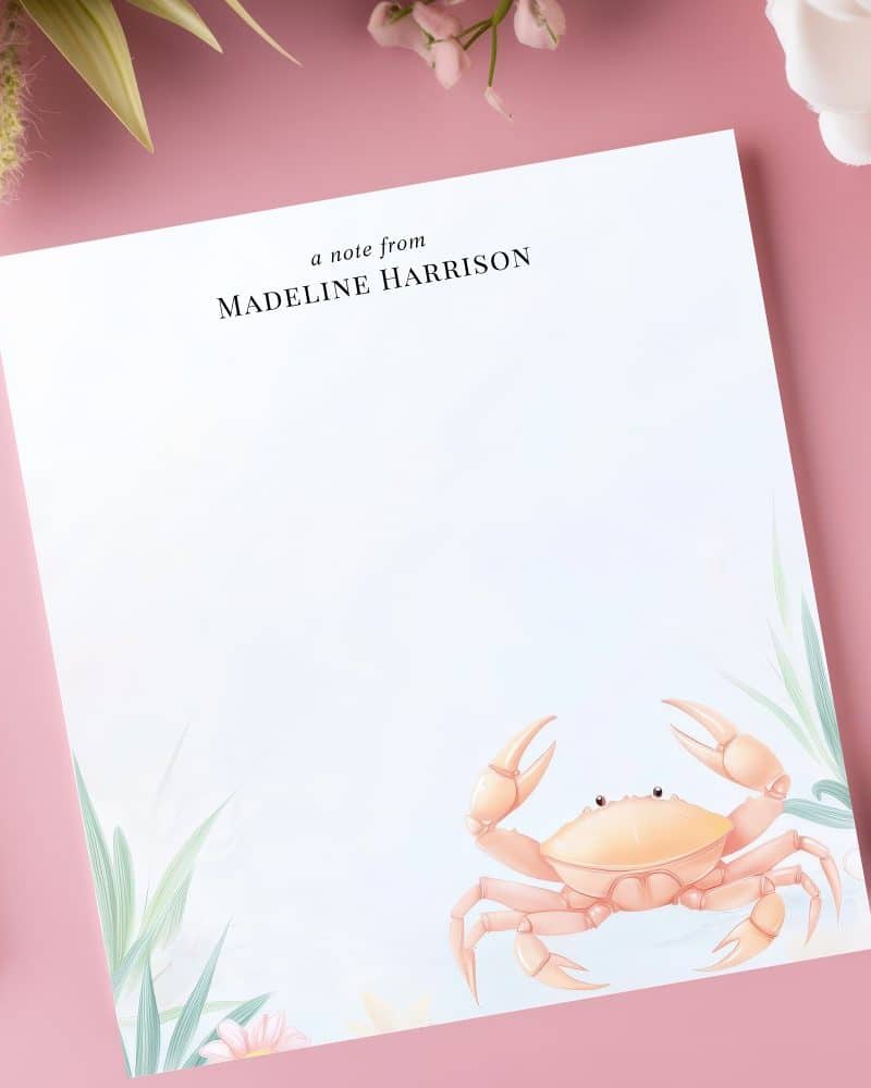 Personalized stationery featuring a light orange crab illustration.