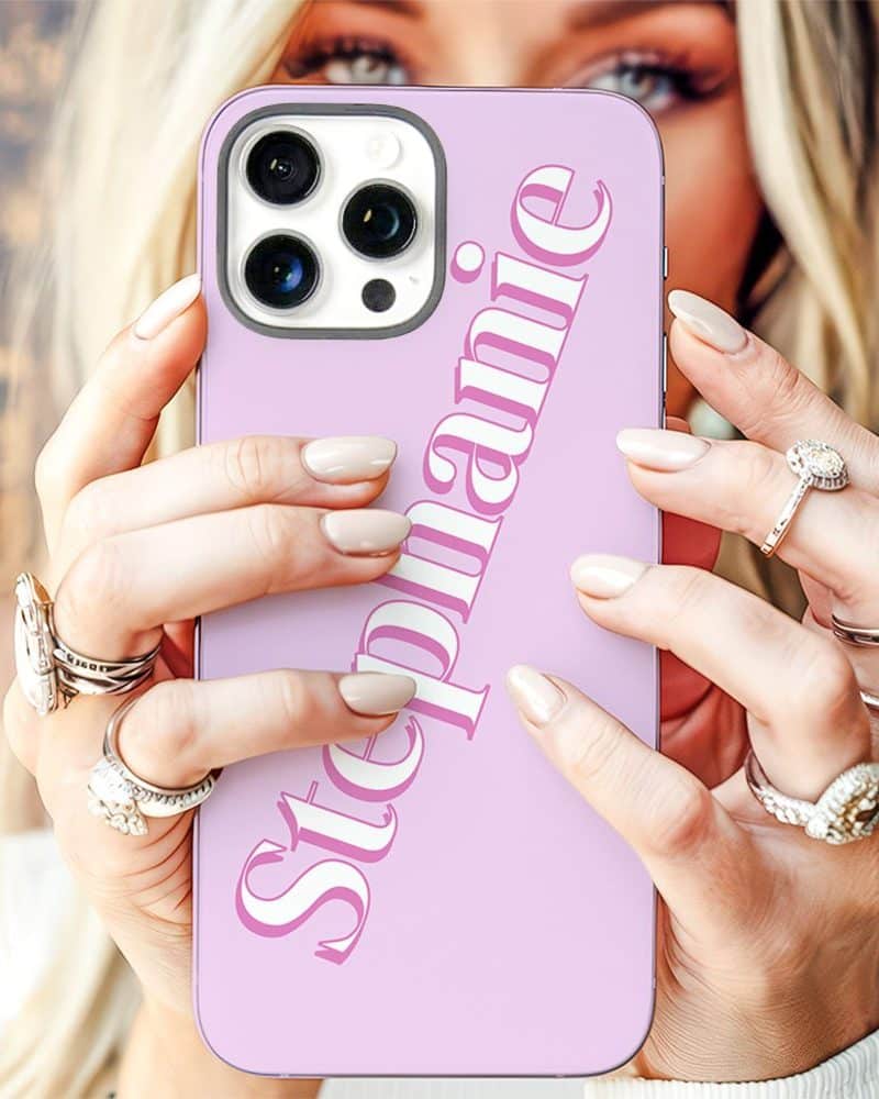 Woman's hands holding a light purple phone case with the name Stephanie printed on it.