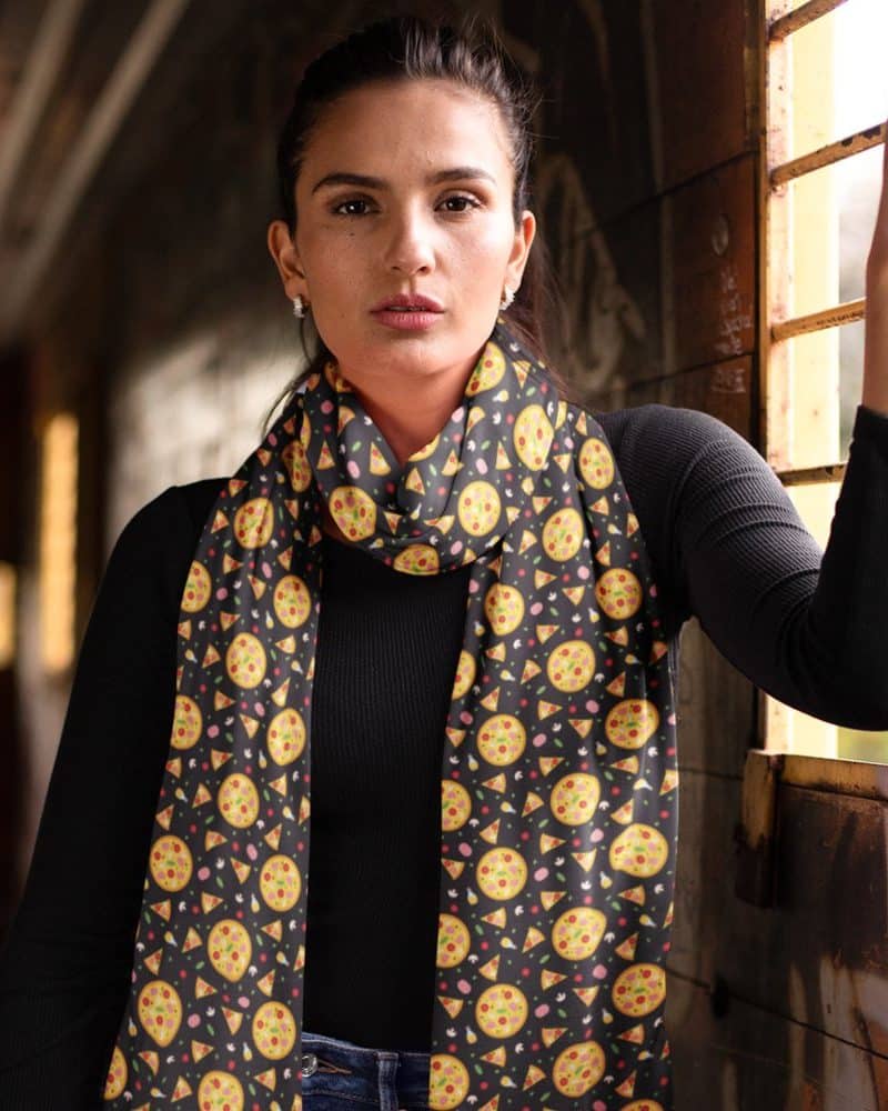 Woman wearing a black scarf with a pizza print.