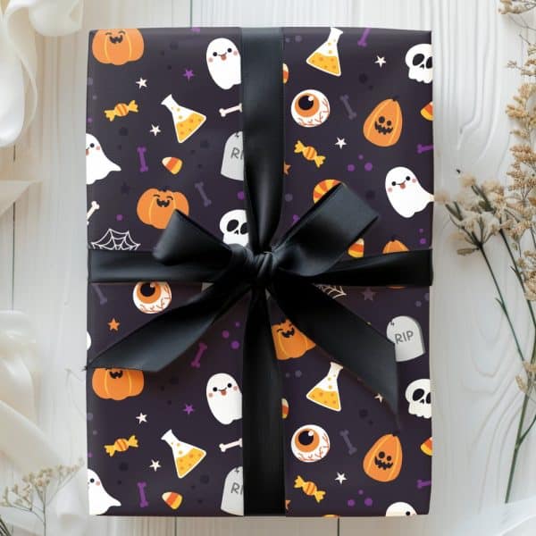 Halloween Gift Wrapped In Dark Purple Paper With A Black Ribbon. The Paper Features A Pattern Of Cartoon Pumpkins, Ghosts, Eyeballs, And Candy Corn.