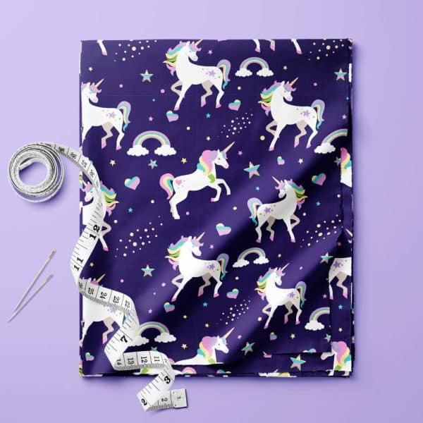 Purple Fabric With A Repeating Pattern Of Pastel Unicorns, Rainbows, And Stars.