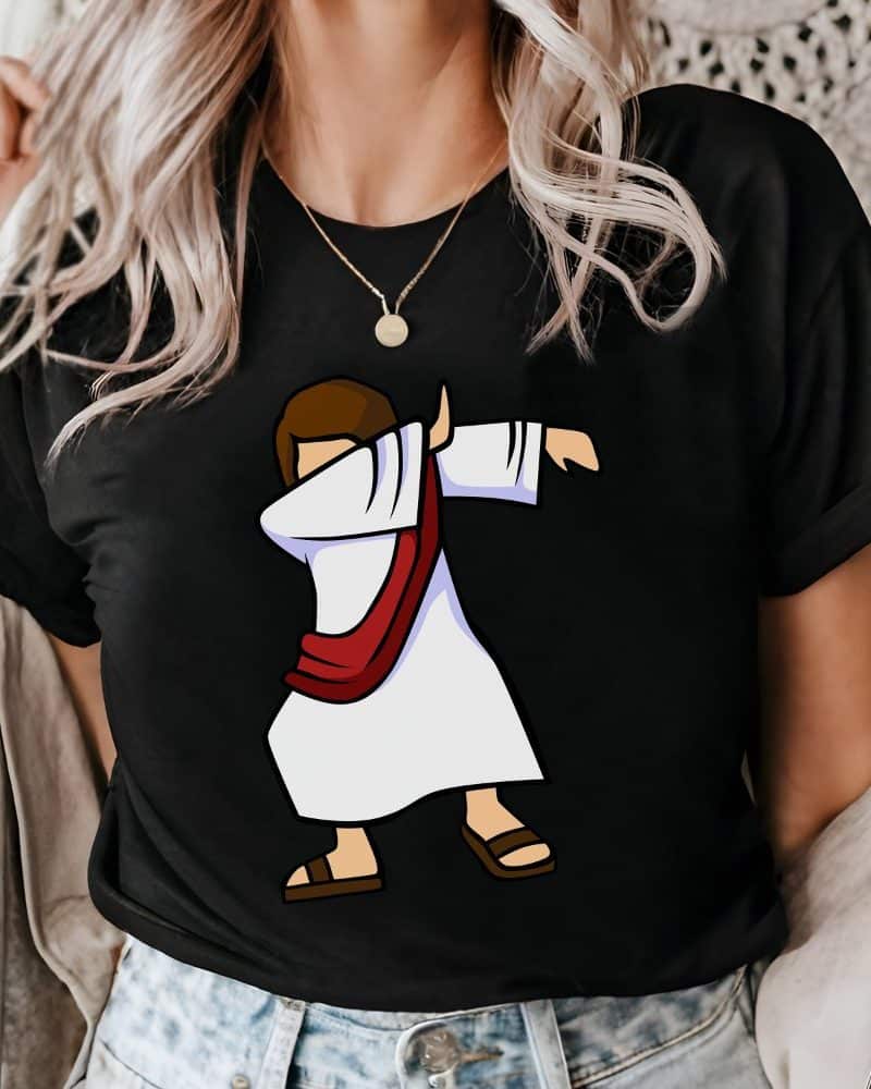 Woman wearing a black t-shirt featuring a cartoon depiction of Jesus doing the dab.