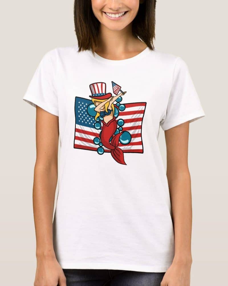 Patriotic mermaid dabbing in front of an American flag.