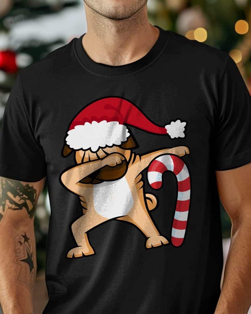 A person wearing a black t-shirt featuring a pug in a Santa hat dabbing next to a candy cane.