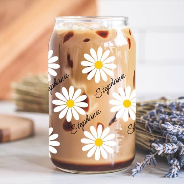 A Glass Iced Coffee Can With Daisies And The Name Stephanie Printed On It.
