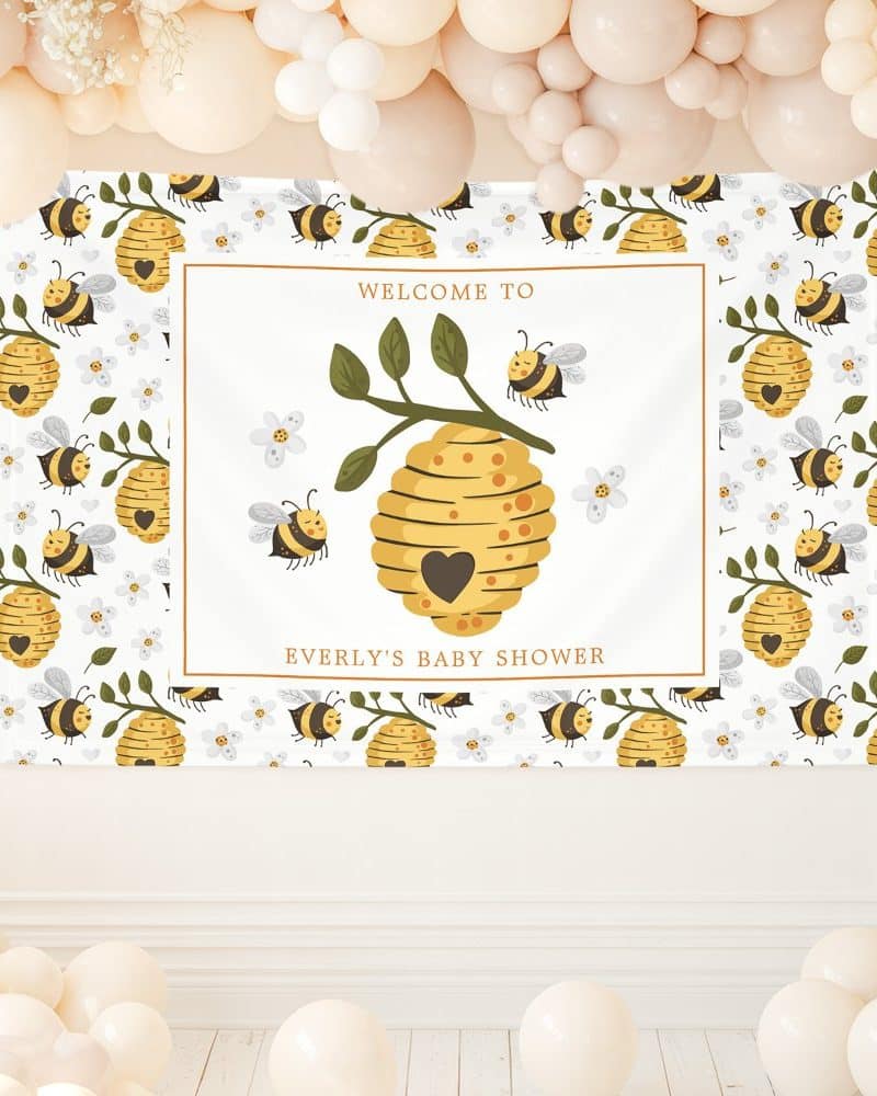 Baby shower banner featuring a beehive and bees.