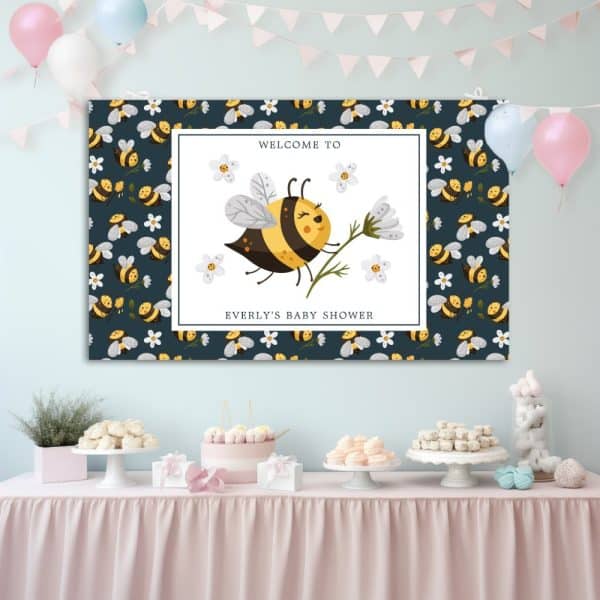 Baby Shower Banner Featuring A Cute Cartoon Bee Holding A Flower. The Banner Has A Dark Background With A Repeating Bee Pattern.